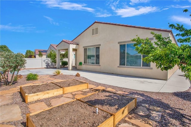 18870 Stetson St, Apple Valley, CA 92308 - rear view of property with a garden, a patio, stucco siding, and a tile roof