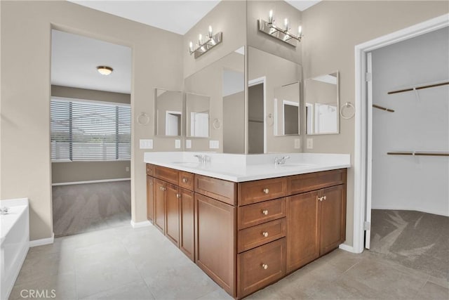 18870 Stetson St, Apple Valley, CA 92308 - bathroom featuring double vanity, tile patterned flooring, a garden tub, and a spacious closet