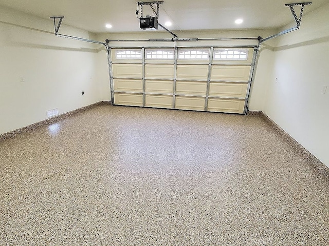 garage featuring a garage door opener and recessed lighting