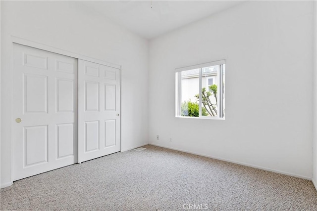 375 Partridge Ave, Paso Robles, CA 93446 - unfurnished bedroom featuring a closet, carpet flooring, and baseboards