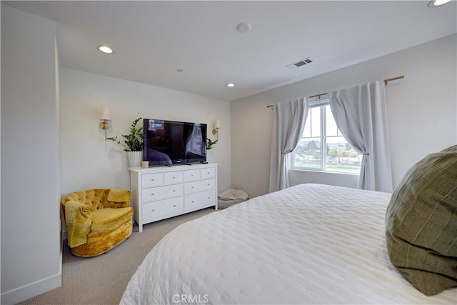carpeted bedroom with recessed lighting and visible vents