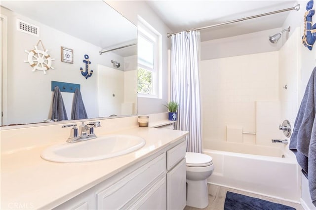 bathroom with visible vents, shower / bath combo with shower curtain, toilet, and vanity