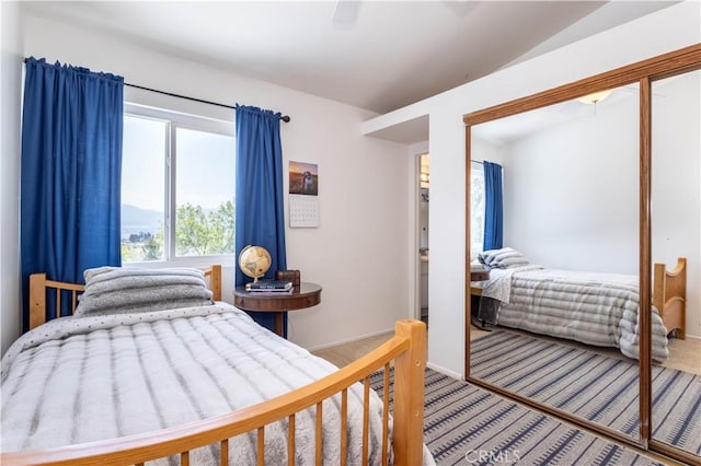 bedroom with ceiling fan, baseboards, and carpet