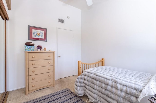 bedroom with a ceiling fan, light colored carpet, and visible vents