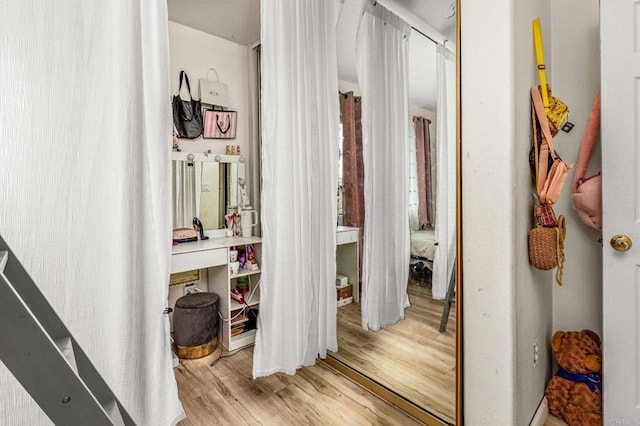 corridor with light wood-style floors