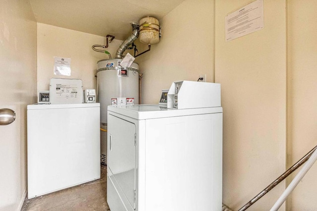 washroom featuring washing machine and dryer and water heater