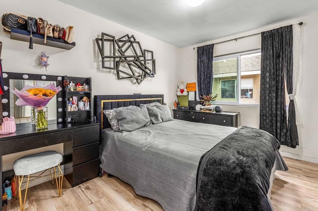 bedroom featuring wood finished floors