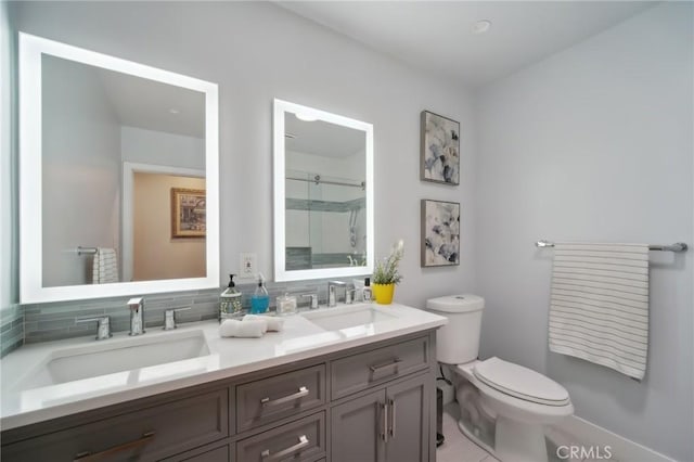 full bath with walk in shower, toilet, double vanity, and a sink