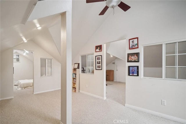 bonus room with ceiling fan, carpet flooring, baseboards, visible vents, and lofted ceiling