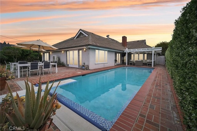 view of pool featuring a patio, an outdoor hangout area, a fenced in pool, and a pergola