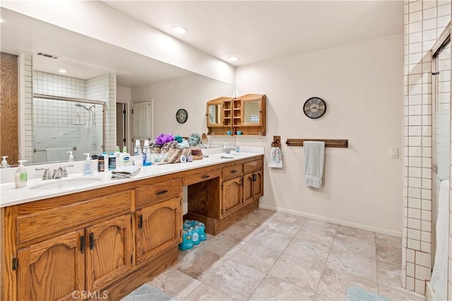 full bathroom with a sink, recessed lighting, double vanity, and a stall shower