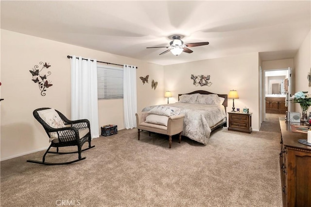 bedroom featuring light carpet and baseboards
