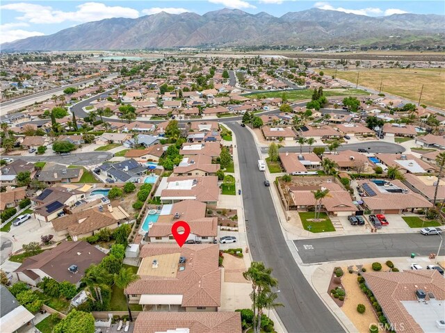 birds eye view of property with a residential view and a mountain view