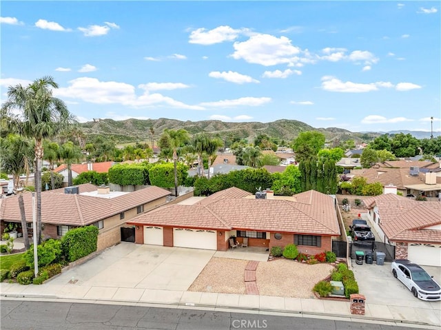 birds eye view of property with a residential view and a mountain view