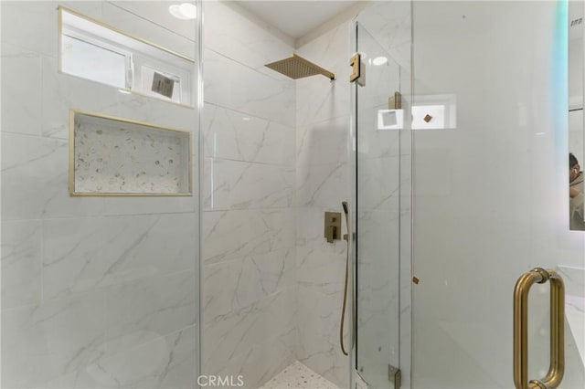 full bath featuring a marble finish shower