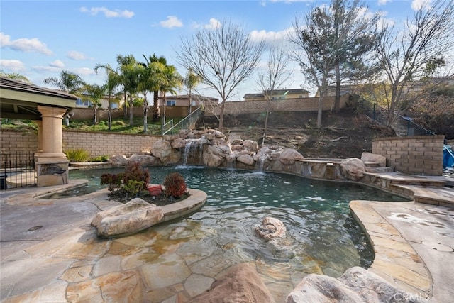 view of pool with a fenced backyard and a fenced in pool