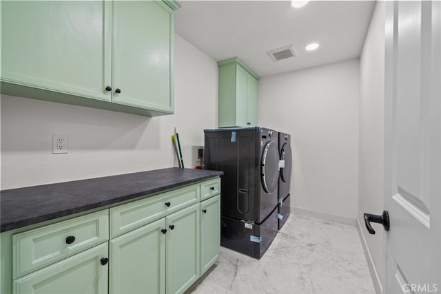 washroom with marble finish floor, washer and clothes dryer, visible vents, baseboards, and cabinet space
