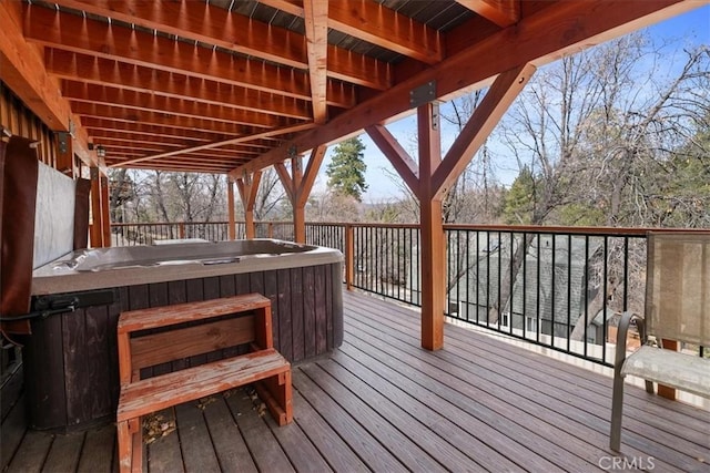 wooden terrace featuring a hot tub