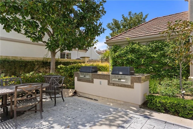 1 Giverny, Newport Coast, CA 92657 - view of patio / terrace with an outdoor kitchen and outdoor dining space
