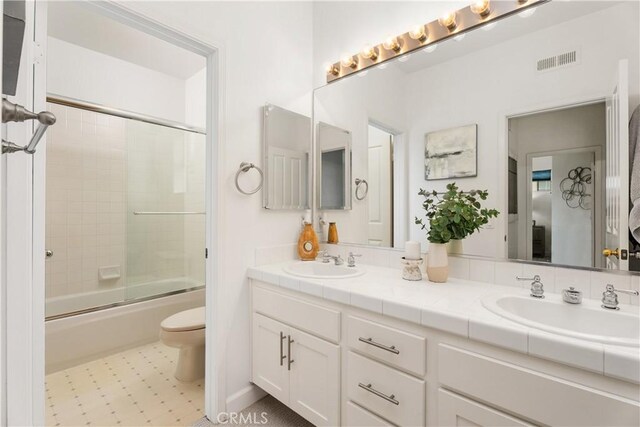 1 Giverny, Newport Coast, CA 92657 - full bathroom with double vanity, shower / bath combination with glass door, and tile patterned flooring