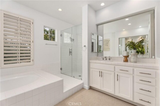 1 Giverny, Newport Coast, CA 92657 - full bathroom with vanity, a shower stall, a bath, and recessed lighting
