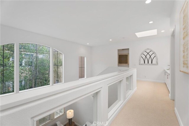 1 Giverny, Newport Coast, CA 92657 - hallway with a skylight, recessed lighting, and light colored carpet