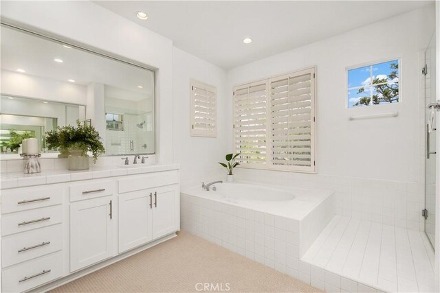 1 Giverny, Newport Coast, CA 92657 - bathroom with vanity, a tile shower, a garden tub, and recessed lighting