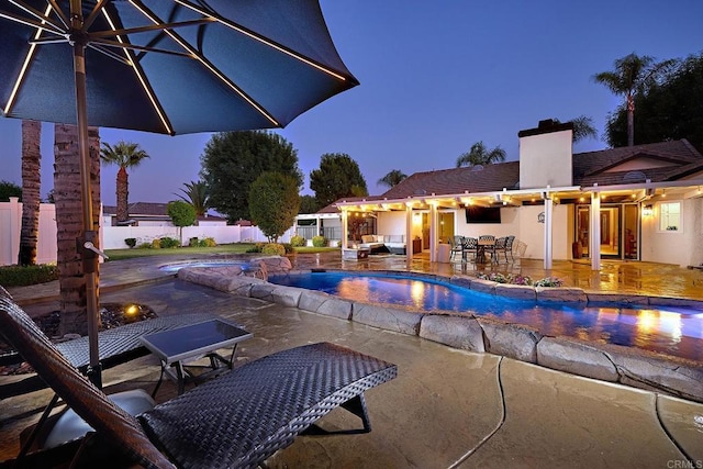 view of pool featuring a fenced in pool, fence, outdoor dining area, a patio, and an outdoor living space