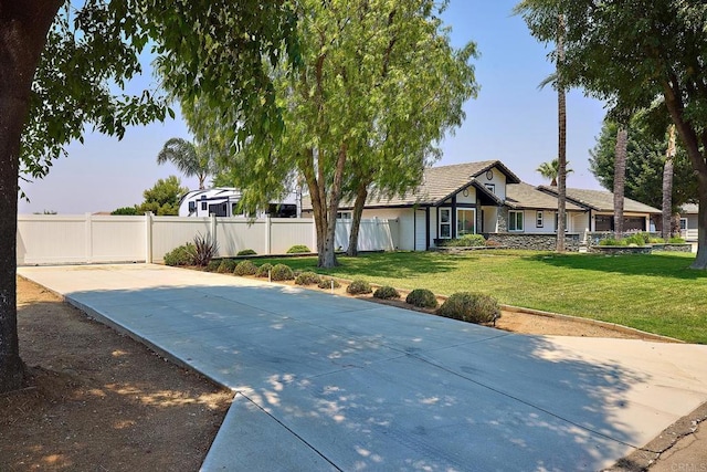 exterior space with a lawn and fence