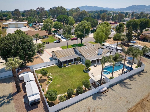 drone / aerial view featuring a residential view and a mountain view
