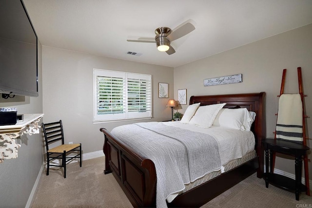 bedroom with light carpet, baseboards, visible vents, and a ceiling fan