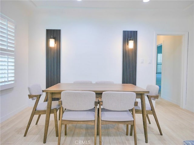 dining space with light wood-style floors, recessed lighting, and baseboards
