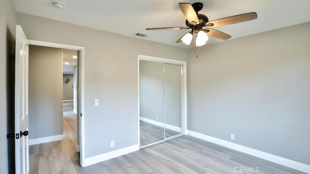18971 Birch St, Perris, CA 92570 - unfurnished bedroom with wood finished floors, a closet, baseboards, and ceiling fan
