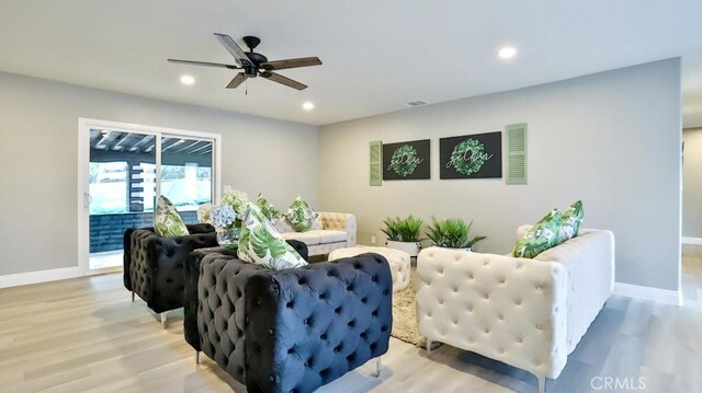 18971 Birch St, Perris, CA 92570 - living area featuring baseboards, ceiling fan, light wood-style floors, and recessed lighting