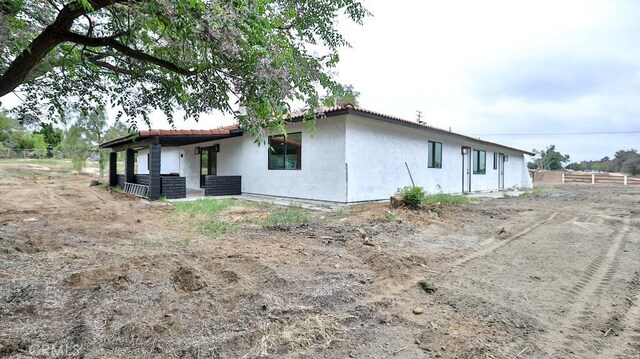 18971 Birch St, Perris, CA 92570 - back of house with fence and stucco siding