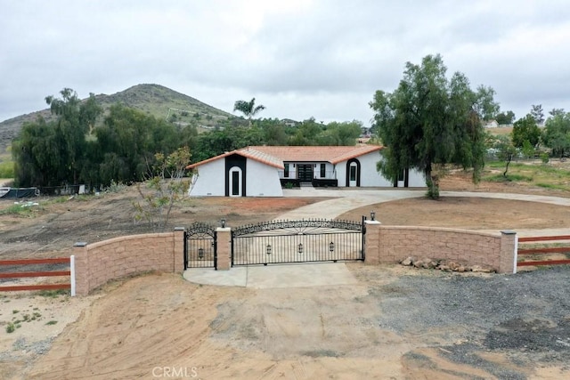 18971 Birch St, Perris, CA 92570 - view of front of property featuring a gate, fence, and a mountain view