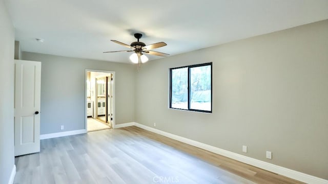 18971 Birch St, Perris, CA 92570 - unfurnished bedroom featuring light wood finished floors, baseboards, ceiling fan, and ensuite bathroom