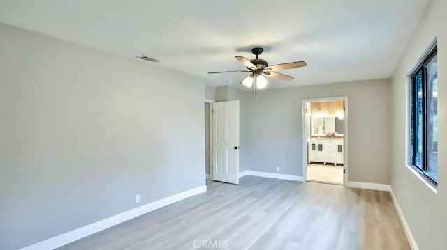18971 Birch St, Perris, CA 92570 - unfurnished bedroom with light wood-style flooring, multiple windows, baseboards, and a ceiling fan