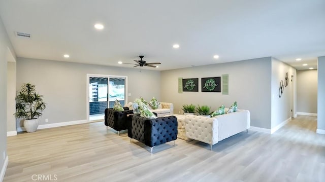 18971 Birch St, Perris, CA 92570 - living room with light wood-type flooring, baseboards, recessed lighting, and ceiling fan