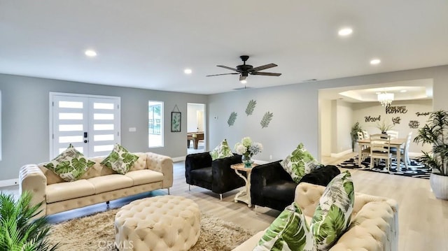 18971 Birch St, Perris, CA 92570 - living room featuring recessed lighting, light wood finished floors, baseboards, ceiling fan, and a chandelier