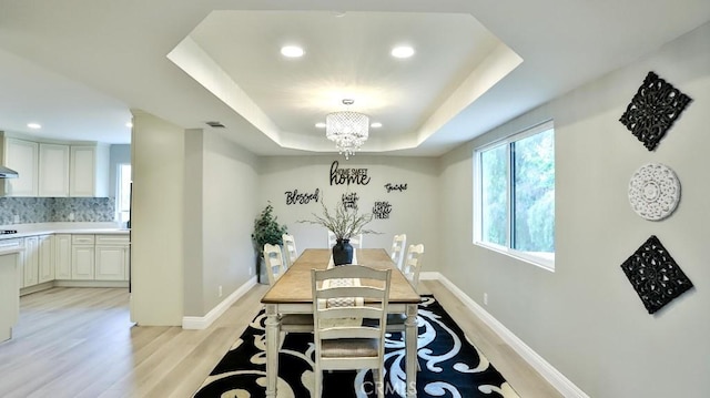 18971 Birch St, Perris, CA 92570 - dining space featuring light wood finished floors, recessed lighting, a raised ceiling, and baseboards