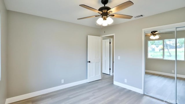 18971 Birch St, Perris, CA 92570 - unfurnished bedroom with light wood-style floors, a closet, baseboards, and ceiling fan