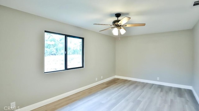 18971 Birch St, Perris, CA 92570 - spare room featuring ceiling fan, light wood-style flooring, and baseboards