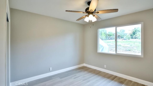 18971 Birch St, Perris, CA 92570 - spare room featuring baseboards, light wood-type flooring, and a ceiling fan