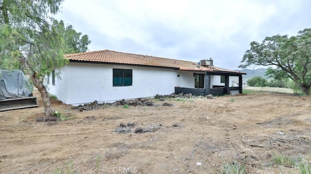 18971 Birch St, Perris, CA 92570 - rear view of property featuring stucco siding and a tiled roof