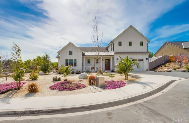 1221 Gable Ct, San Marcos, CA 92069 - view of front facade featuring an attached garage, board and batten siding, driveway, and covered porch