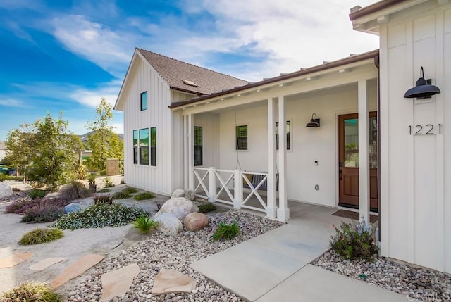 1221 Gable Ct, San Marcos, CA 92069 - view of exterior entry featuring board and batten siding and covered porch