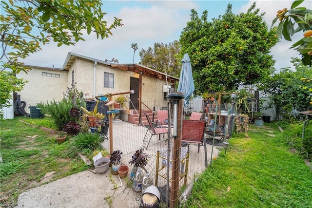 490 Crosby St, Altadena, CA 91001 - rear view of house with a yard, a patio area, stucco siding, and fence
