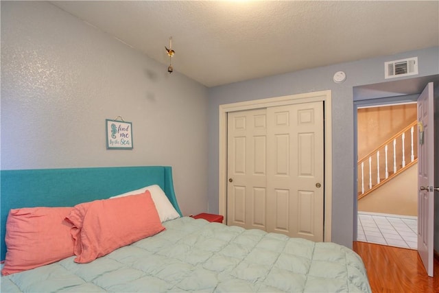 1268 Baden Ave, Grover Beach, CA 93433 - bedroom featuring wood finished floors, visible vents, and a closet