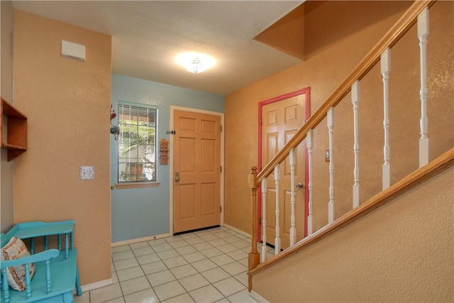 1268 Baden Ave, Grover Beach, CA 93433 - foyer entrance featuring baseboards, stairs, and light tile patterned flooring